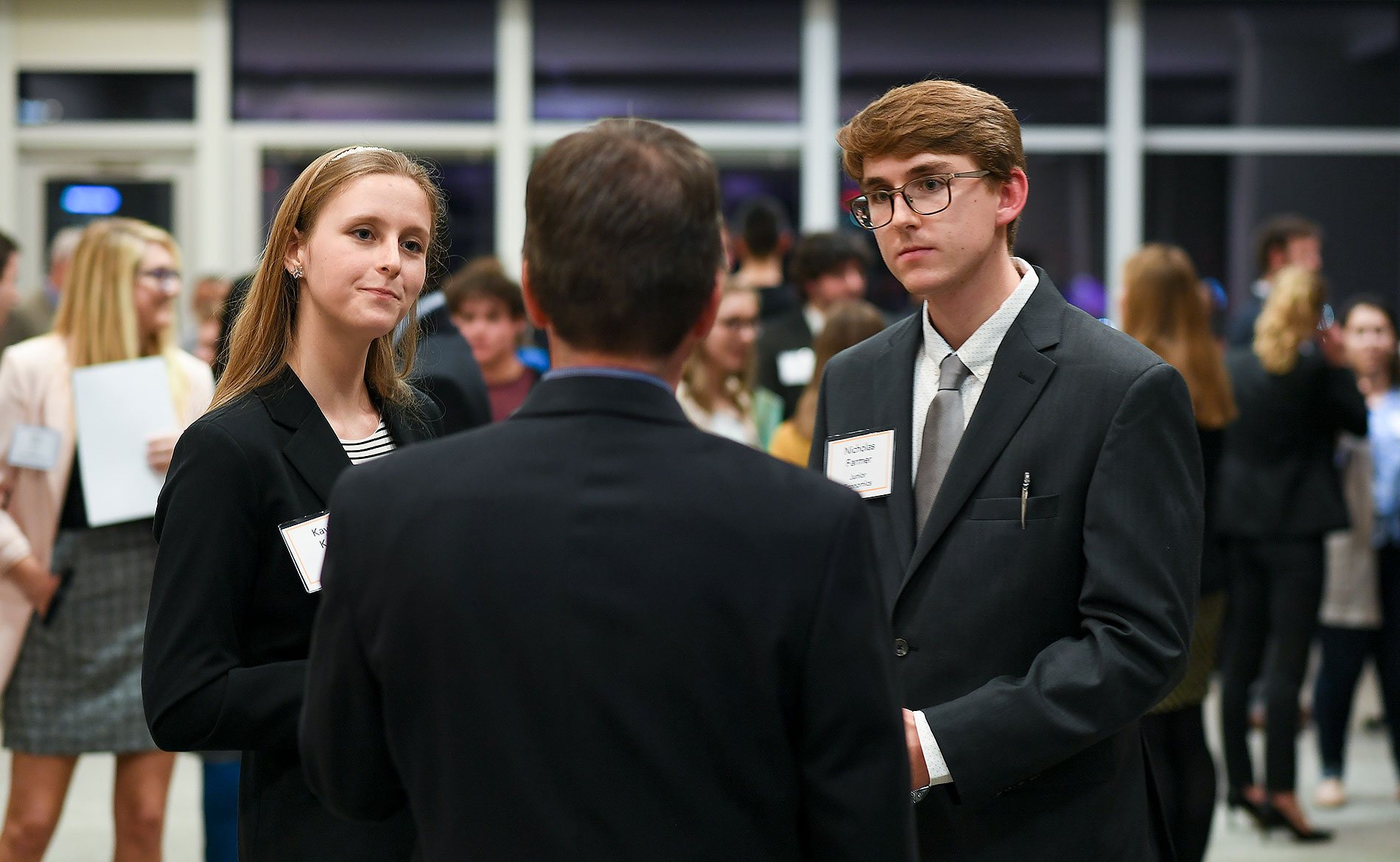 group of people talking at a conference