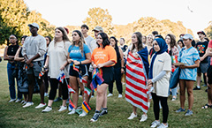 diverse group of students with flags